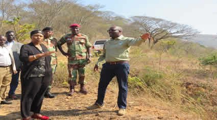 Minister being shown Cleared land